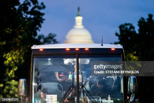 Migrants, who boarded a bus in Texas, are dropped off within view of the US Capitol in Washington, DC, on August 11, 2022. - Since April, Texas...