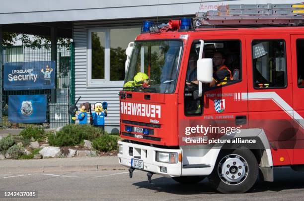 August 2022, Bavaria, Günzburg: A fire truck drives past the entrance to Legoland. At least 34 people were injured, two of them seriously, in an...