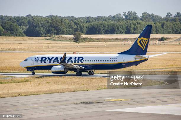 Ryanair Boeing 737-800 aircraft as seen departing from the Dutch airport Eindhoven EIN. The airplane is spotted during the taxiing, take off and...