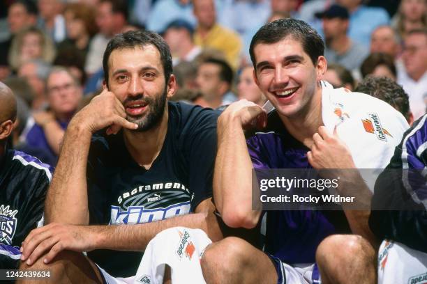 Vlade Divac and Peja Stojakovic of the Sacramento Kings look on during a game against the Golden State Warriors on November 8, 2000 at the Arco Arena...