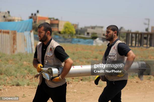 Explosives experts of Hamas they get rid of an unexploded Iron Dome missile, that fell in a field during in last week's Israeli air strikes, in Khan...