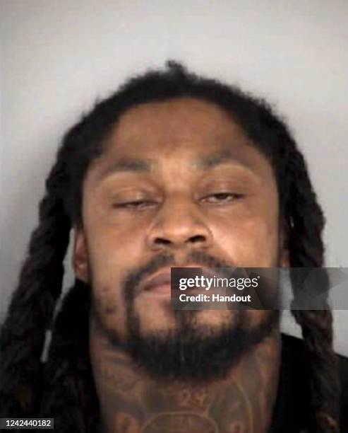 In this handout provided by the City of Las Vegas, Former NFL running back Marshawn Lynch poses for a mugshot in Las Vegas, Nevada. Lynch was...