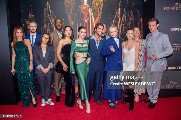 English actress Emily Carey and English actor Matt Smith join other cast members of the new HBO Max series House of the Dragon as they pose during...