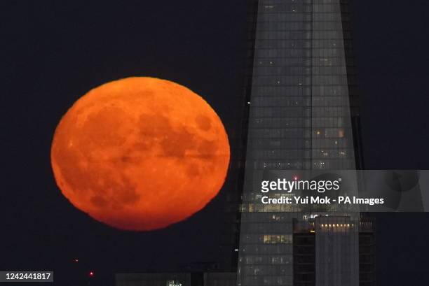 The Sturgeon supermoon, the final supermoon of the year, rises behind The Shard in London. Picture date: Thursday August 11, 2022.