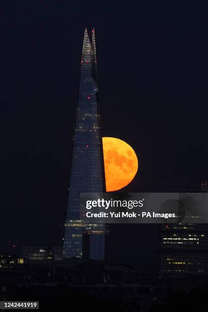 The Sturgeon supermoon, the final supermoon of the year, rises behind The Shard in London. Picture date: Thursday August 11, 2022.