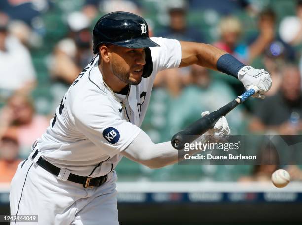 Victor Reyes of the Detroit Tigers lays down a bunt single against the Cleveland Guardians during the eighth inning at Comerica Park on August 11 in...