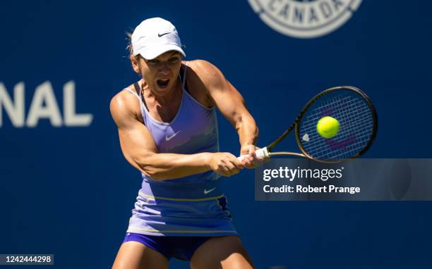 Simona Halep of Romania hits a shot against Jil Teichmann of Switzerland in her third round match on Day 6 of the National Bank Open, part of the...