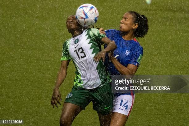 France's Anaelle Tchakounte and Nigeria's Mercy Idoko vie for the ball during their Women's U-20 World Cup football match at the national stadium in...