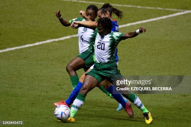 France's Megane Hoeltzel vies for the ball with Nigeria's Deborah Abiodun and Joy Jerry during their Women's U-20 World Cup football match at the...