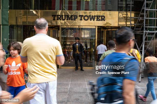 People walk by Trump Tower in Manhattan on August 10, 2022 in New York City. According to a recent report, the FBI was looking for nuclear-related...