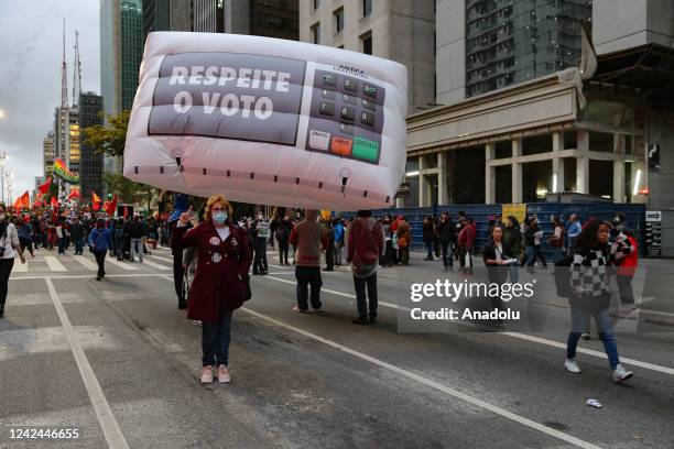 People stage a demonstration against Brazilian President Jair Bolsonaro and in defense of democracy and elections at Avenida Paulista in Sao Paulo,...