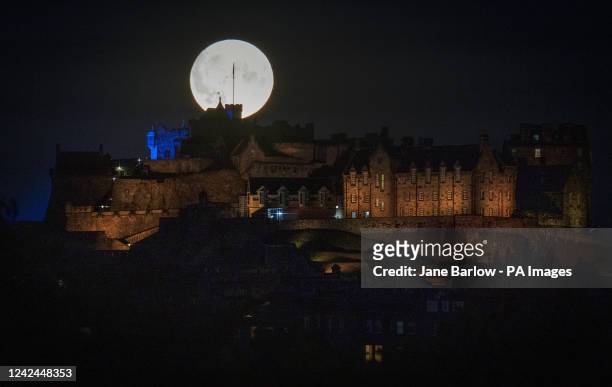 The Sturgeon supermoon, the final supermoon of the year, rises behind Edinburgh Castle. Picture date: Thursday August 11, 2022.