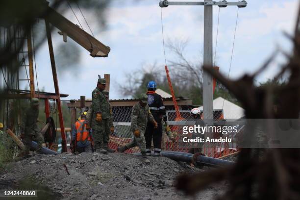 Rescue personnel take part in an operation attempting to reach 10 miners trapped in a flooded coal mine following a landslide a week ago, in Sabinas...