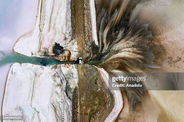 An aerial view of Lake Salt as teams conduct salt extraction works at lake which is a significant portion of Turkiye's salt need is met in Ankara,...