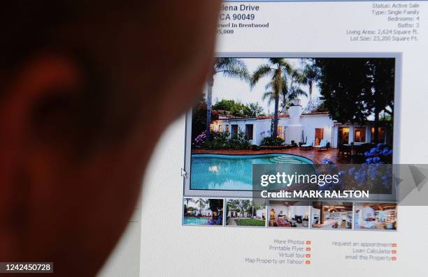 Man views a property for sale on a website advertising the former home of actress Marilyn Monroe which was the scene of her death in the Brentwood...
