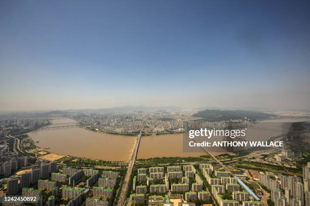 General view taken from the Lotte World Tower Seoul Sky shows residential and commercial buildings on the north, known as Gangbuk and south side,...