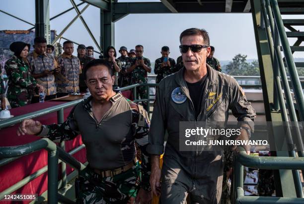 Commander of the US Indo-Pacific Command Admiral John Aquilino walks with Indonesian Armed Forces Chief General Andika Perkasa during the Super...