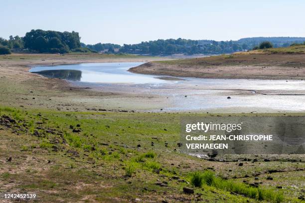 This photograph taken on August 12 shows Bouzey reservoir's drought in Bouzey, eastern France. - The "Lac de Bouzey", an artifical lake located in...