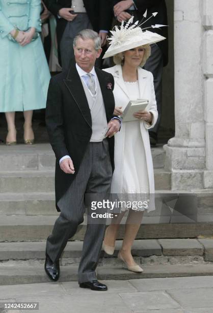 Britain's Prince Charles and new wife Camilla leave the Guildhall in Windsor after their civil wedding ceremony, 09 April 2005. Prince Charles and...