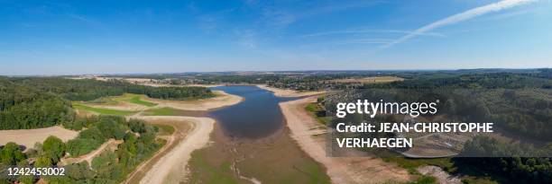 Combination of 21 photographs taken on August 12 shows an aerial view of Bouzey reservoir's drought, in Bouzey, eastern France. - The "Lac de...