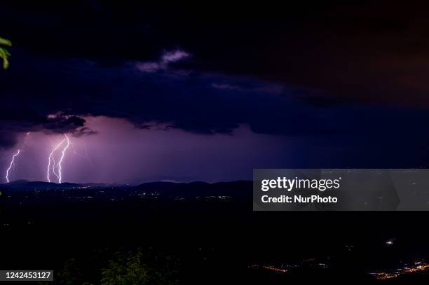 Lightning during a thunderstorm illuminates the evening of 11 August 2022, in the province of Rieti, Italy.