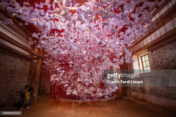 August 12: Visitors at the intervention named "Tell me your Story" by Japanese artist Chiharu Shiota installed in the Turkish bath on August 12, 2022...