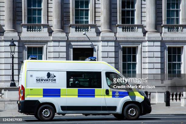 Metropolitan Police vehicle branded with Project Servator passes along Whitehall on 10th August 2022 in London, United Kingdom. Project Servator is...