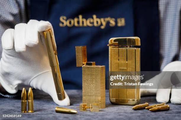 Component parts of a limited edition replica of the gun from the film ‘The Man with the Golden Gun’ are displayed on August 14, 2022 ahead of...