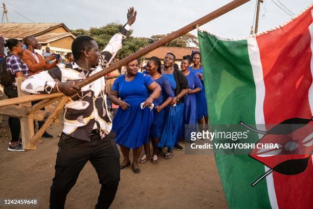 Member of Evangelism Harvest Fellowship Church holds a Kenyan flag during their special prayer for the nation's peace as people wait for the result...