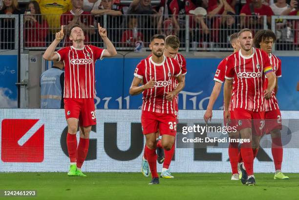Michael Gregoritsch of SC Freiburg celebrates after scoring his team's first goal with teammates during the Bundesliga match between Sport-Club...