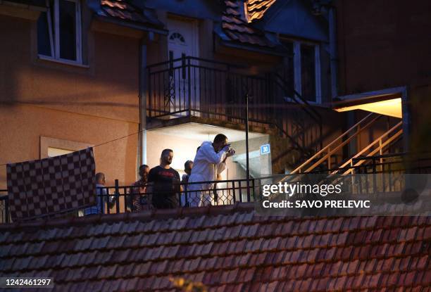 Emergency service personnel, police officers and investigators operate the scene of a shooting in Cetinje, in Montenegro, on August 12, 2022. - At...