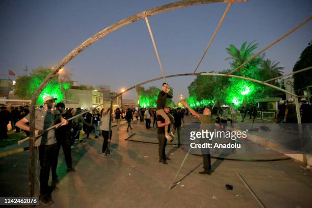 Supporters of Shiite cleric Moqtada al-Sadr continue sit-in protest on the 14th day with the tents that they set up around the Parliament building in...