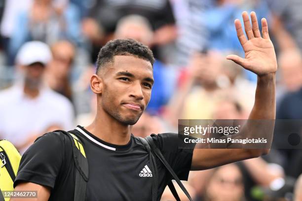 Felix Auger-Aliassime of Canada salutes the spectators as he walks off the court after his loss too Casper Ruud of Norway during Day 7 of the...