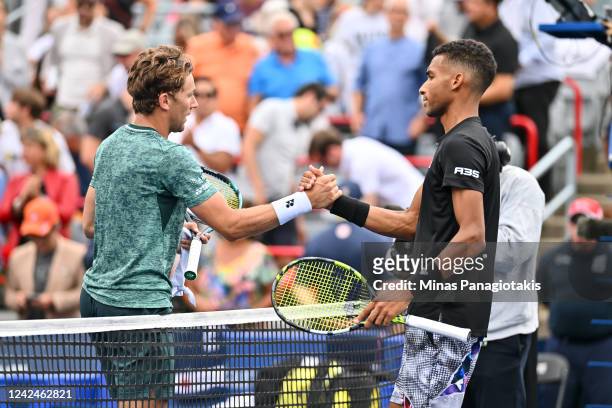 Casper Ruud of Norway and Felix Auger-Aliassime of Canada shake hands after their match during Day 7 of the National Bank Open at Stade IGA on August...