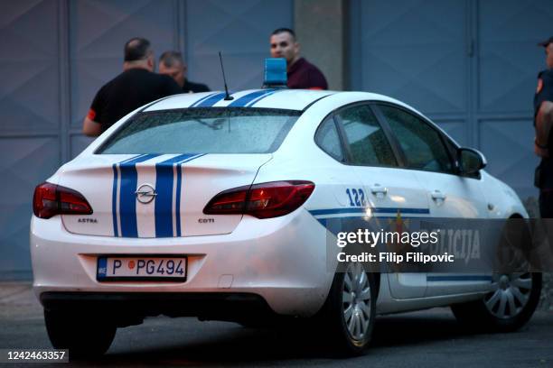 Police officers close off the crime scene after a shooting on August 12, 2022 in Cetinje, Montenegro. Twelve people including the gunman have been...