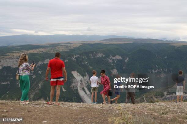 Tourists near the abyss watch the Sulak Canyon, a tourist attraction in the Dagestan is one of the deepest canyons in the world and the deepest in...