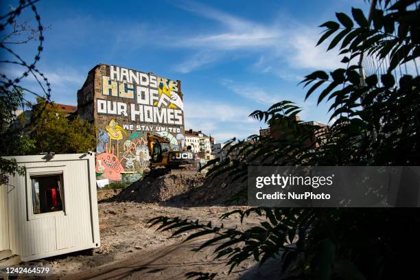 Giant graffiti is seen on a wall of the alternative housing community Koepi in Berlin, Germany on August 12, 2022. The housing projet is one of...