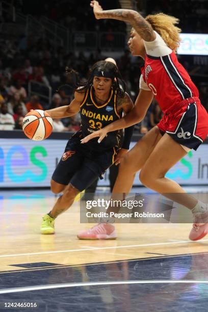 Destanni Henderson of the Indiana Fever drives to the basket during the game against the Washington Mystics on August 12, 2022 at the Gainbridge...