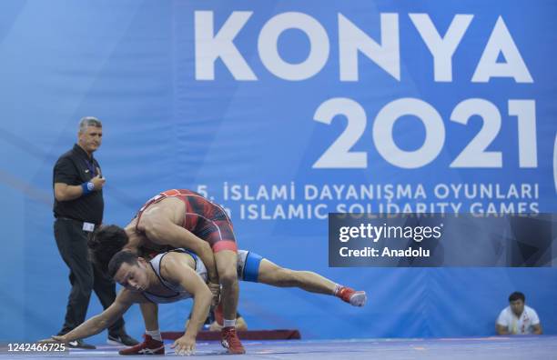 Murat Dag of Turkiye in action against Bek Konurbaev of Kyrgyzstan in wrestling competitions as part of the 5th Islamic Solidarity Games in Konya,...