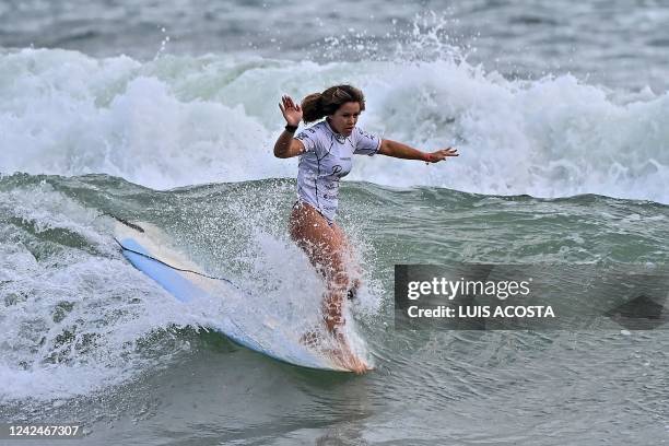 Brazil's Atalanta Batista competes in the women's surfing longboard final during the Pan American Surf Association Games Panama 2022, in Venao Beach,...