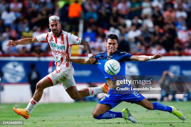 Facundo Batista of Necaxa struggles for the ball agains Hector Moreno of Monterrey during the 8th round match between Necaxa and Monterrey as part of...