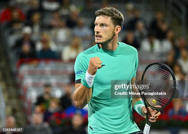 Pablo Carreno Busta of Spain reacts after winning a point against Jack Draper of Great Britain during Day 7 of the National Bank Open at Stade IGA on...