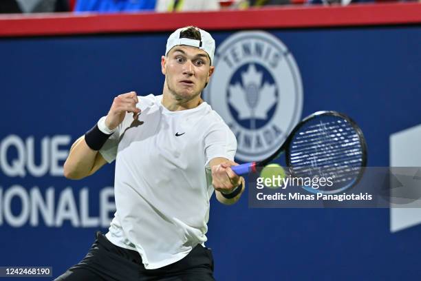 Jack Draper of Great Britain hits a return against Pablo Carreno Busta of Spain during Day 7 of the National Bank Open at Stade IGA on August 12,...