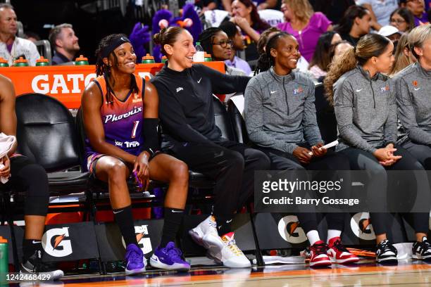 Diamond Deshields, Diana Taurasi, and Assistant Coach Crystal Robinson of the Phoenix Mercury look on during the game against the Dallas Wings on...