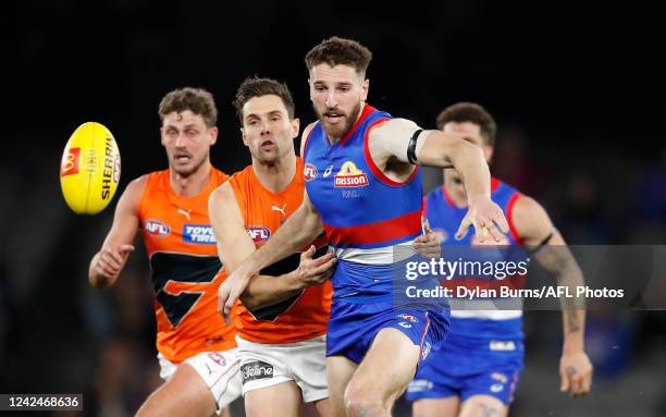 Marcus Bontempelli of the Bulldogs and Josh Kelly of the Giants compete for the ball during the 2022 AFL Round 22 match between the Western Bulldogs...