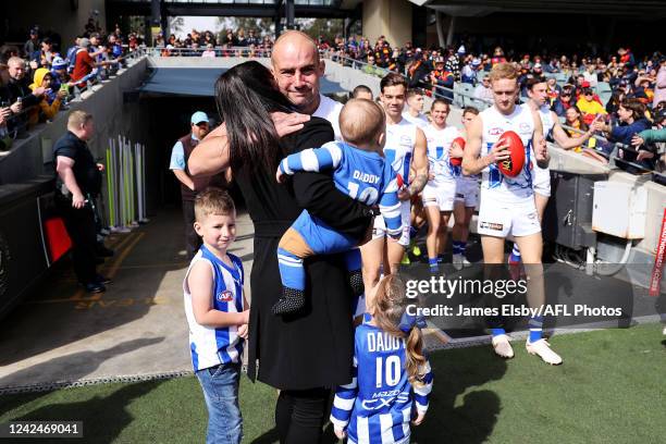 Ben Cunnington of the Kangaroos walks out with his family during the 2022 AFL Round 22 match between the Adelaide Crows and the North Melbourne...