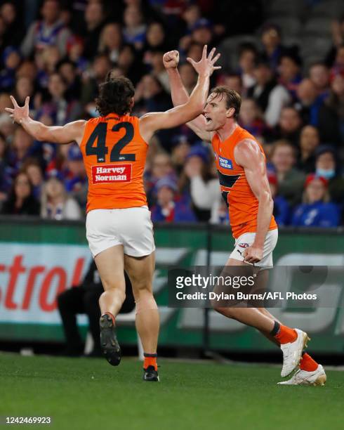 Lachlan Keeffe of the Giants celebrates a goal during the 2022 AFL Round 22 match between the Western Bulldogs and the GWS Giants at Marvel Stadium...