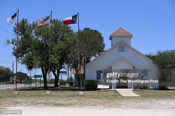 Flags fly outside the former First Baptist Church on June 7, 2022 in Sutherland Springs, Texas. A gunman entered First Baptist Church in 2017 killing...