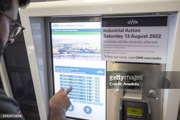 Note, announcing the strike, is hung on a ticket machine at a train station in London, United Kingdom on August 12 as fresh railway strikes hit the...