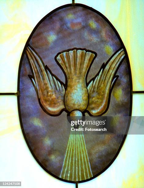 descending dove of pentecost in stain glass window - holy spirit pentecost stock pictures, royalty-free photos & images